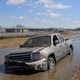 A pickup truck swept aside by flood waters in Norfolk, Nebraska on March 15, 2019